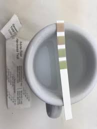 Water Hardness Strip Testing Water in an Espresso Cup